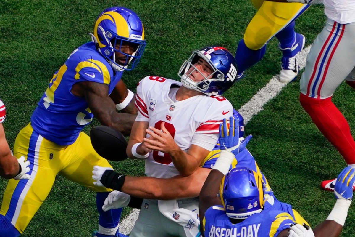 Los Angeles Rams outside linebacker Leonard Floyd (54) knocks the ball out of New York Giants quarterback Daniel Jones' (8) hand resulting in a fumble, recovered by the Giants, in the first half. The Giants fall to the Rams, 38-11, at MetLife Stadium on Sunday, Oct. 17, 2021, in East Rutherford.